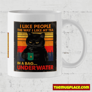 White mug featuring Grumpy Cat holding tea with a funny quote: I like people the way I like my tea—in a bag, under water.